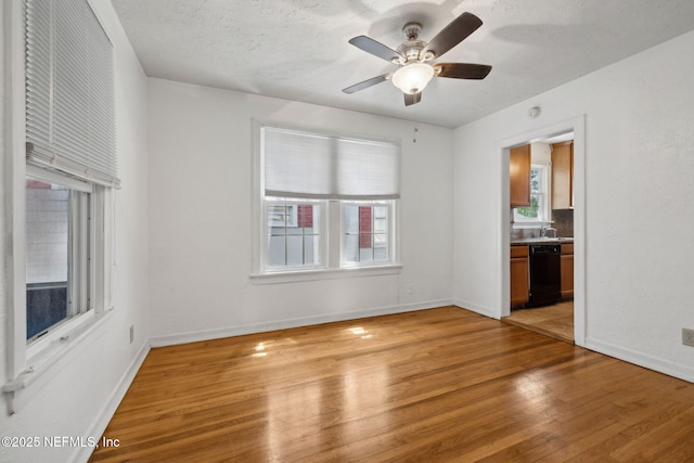 5372 Colonial Ave, Jacksonville, FL 32210 - unfurnished room featuring light wood finished floors, a ceiling fan, and baseboards