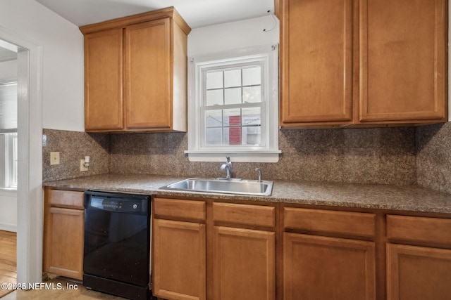 5372 Colonial Ave, Jacksonville, FL 32210 - kitchen featuring black dishwasher, a sink, and backsplash