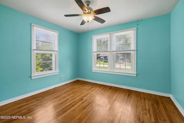 5372 Colonial Ave, Jacksonville, FL 32210 - unfurnished room featuring baseboards, wood finished floors, and a ceiling fan