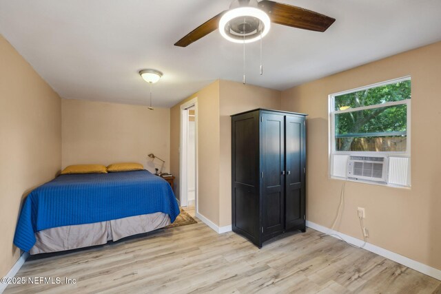 5372 Colonial Ave, Jacksonville, FL 32210 - bedroom featuring light wood-type flooring, baseboards, and cooling unit