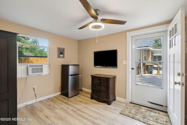 5372 Colonial Ave, Jacksonville, FL 32210 - unfurnished living room with light wood-style floors, cooling unit, ceiling fan, and healthy amount of natural light