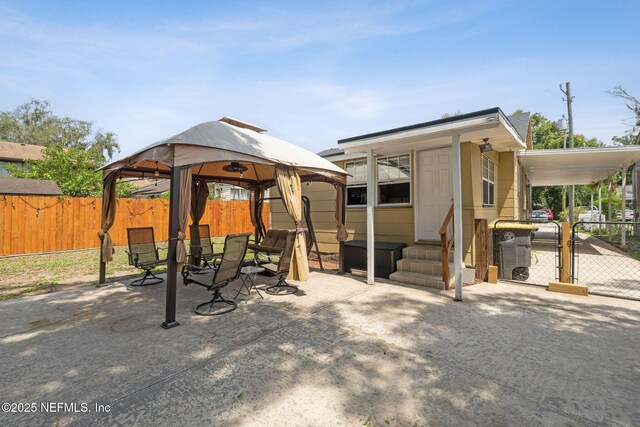 5372 Colonial Ave, Jacksonville, FL 32210 - view of patio featuring a gazebo, a gate, and a carport
