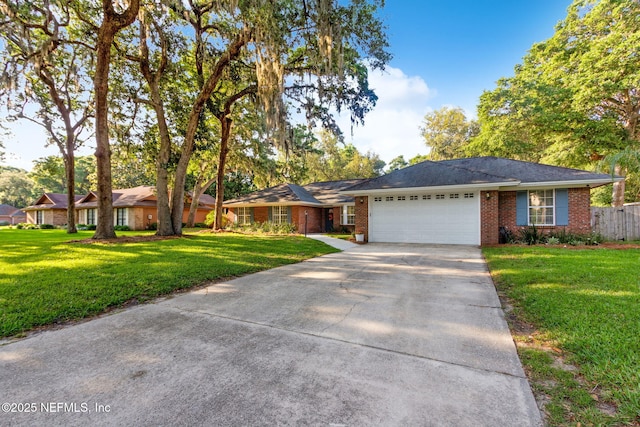 1908 Springbrook Rd, Fernandina Beach, FL 32034 - single story home with a garage, concrete driveway, and brick siding