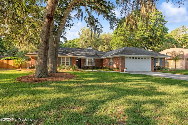 1908 Springbrook Rd, Fernandina Beach, FL 32034 - ranch-style home featuring a garage, brick siding, and driveway