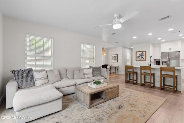 1908 Springbrook Rd, Fernandina Beach, FL 32034 - living area with healthy amount of natural light, light wood-style flooring, ceiling fan, recessed lighting, and baseboards