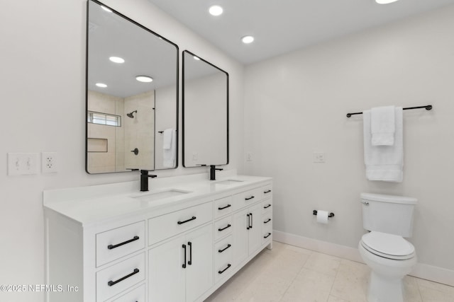 1908 Springbrook Rd, Fernandina Beach, FL 32034 - full bathroom featuring baseboards, double vanity, tiled shower, recessed lighting, and toilet