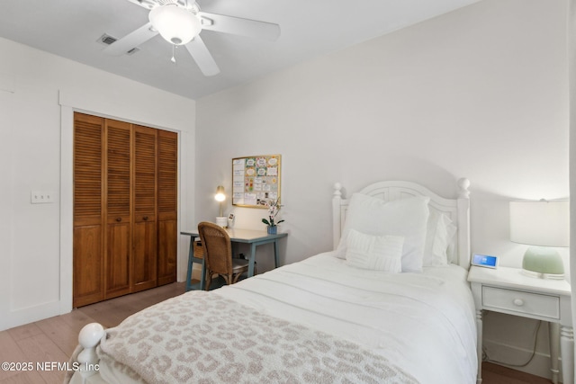1908 Springbrook Rd, Fernandina Beach, FL 32034 - bedroom with a closet, wood finished floors, and a ceiling fan