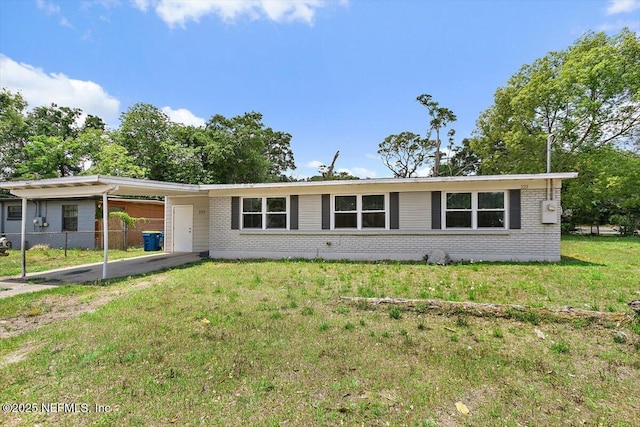 222 Acme St, Jacksonville, FL 32211 - single story home with brick siding and a carport