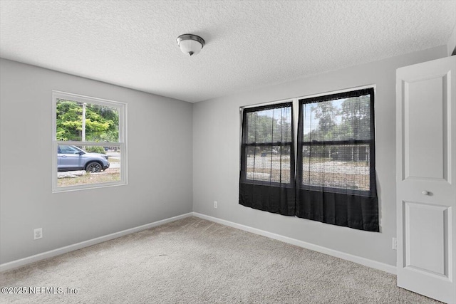 222 Acme St, Jacksonville, FL 32211 - carpeted spare room featuring a textured ceiling and baseboards