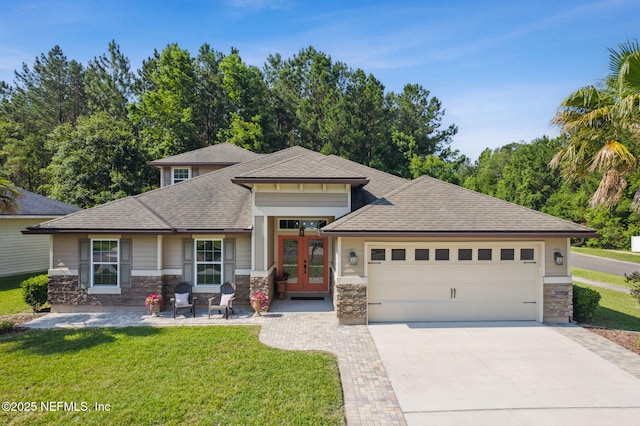 79653 Plummers Creek Dr, Yulee, FL 32097 - prairie-style house with french doors, a front lawn, a garage, driveway, and roof with shingles