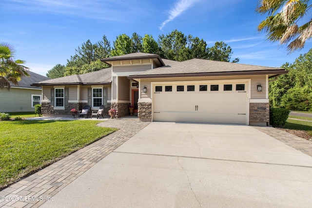 79653 Plummers Creek Dr, Yulee, FL 32097 - prairie-style house featuring concrete driveway, stone siding, a garage, and a front yard