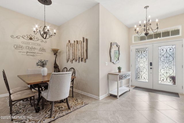 79653 Plummers Creek Dr, Yulee, FL 32097 - dining area featuring a chandelier, french doors, plenty of natural light, and a towering ceiling