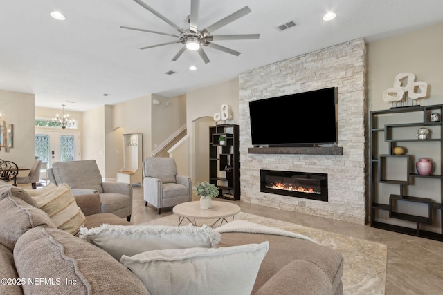 79653 Plummers Creek Dr, Yulee, FL 32097 - living area featuring a ceiling fan, a chandelier, a stone fireplace, recessed lighting, and stairway