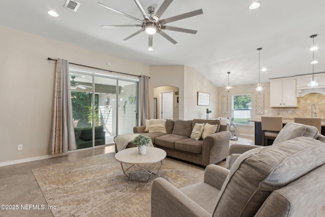 79653 Plummers Creek Dr, Yulee, FL 32097 - living area featuring a ceiling fan, baseboards, arched walkways, recessed lighting, and vaulted ceiling