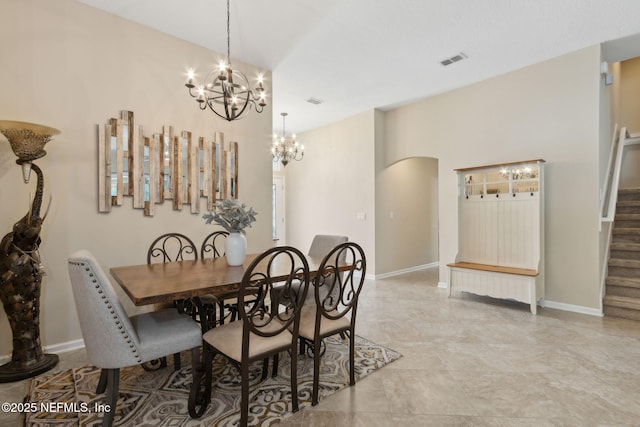 79653 Plummers Creek Dr, Yulee, FL 32097 - dining space with a chandelier, arched walkways, stairs, and baseboards