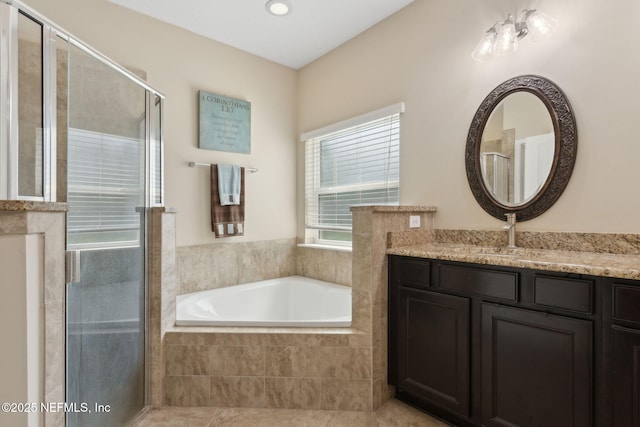 79653 Plummers Creek Dr, Yulee, FL 32097 - bathroom with vanity, a bath, a stall shower, and recessed lighting