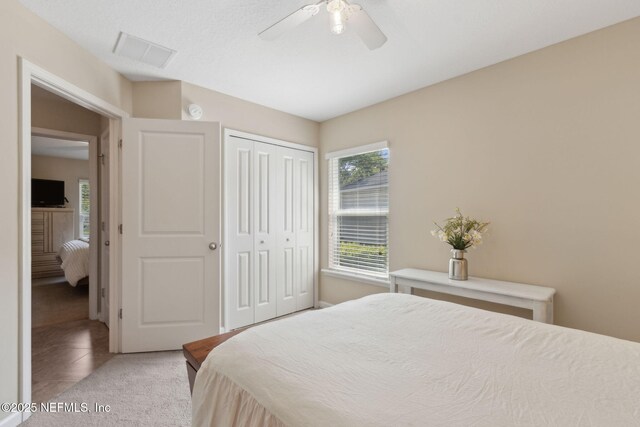 79653 Plummers Creek Dr, Yulee, FL 32097 - bedroom with multiple windows, a closet, ceiling fan, and light tile patterned floors