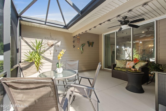 79653 Plummers Creek Dr, Yulee, FL 32097 - sunroom featuring ceiling fan, outdoor dining area, a skylight, and healthy amount of natural light