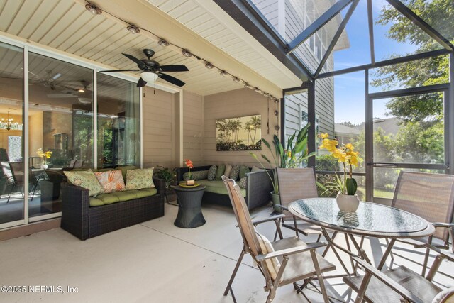 79653 Plummers Creek Dr, Yulee, FL 32097 - view of patio featuring ceiling fan, outdoor lounge area, and glass enclosure
