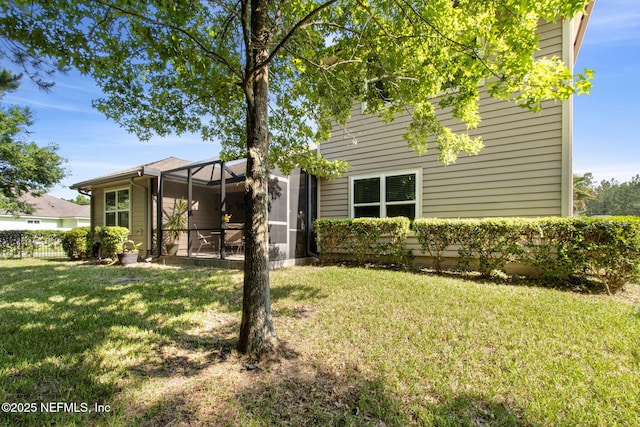 79653 Plummers Creek Dr, Yulee, FL 32097 - back of house featuring glass enclosure