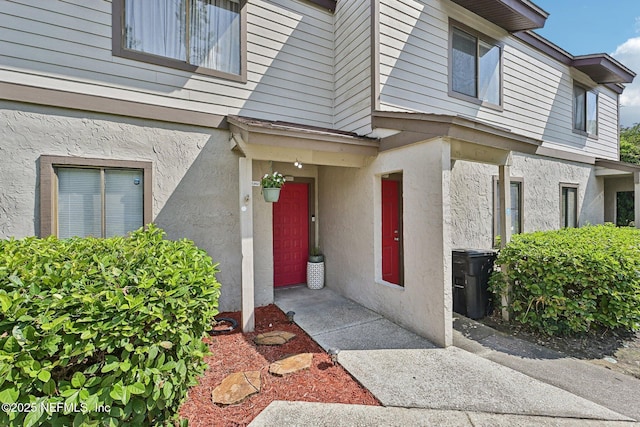 8300 Plaza Gate Ln Unit 1242, Jacksonville, FL 32217 - view of exterior entry with stucco siding