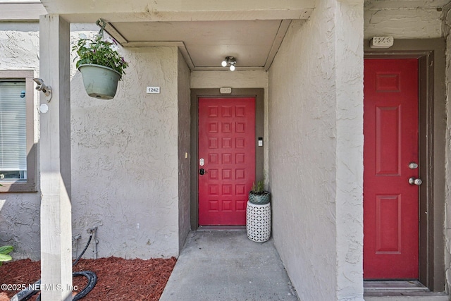 8300 Plaza Gate Ln Unit 1242, Jacksonville, FL 32217 - doorway to property with stucco siding