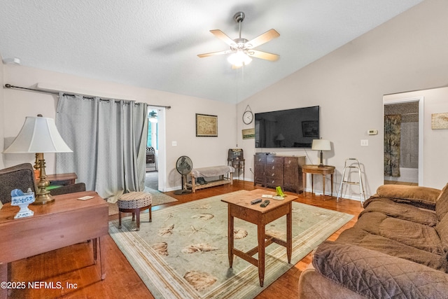 2097 Frogmore Dr, Middleburg, FL 32068 - living area with a ceiling fan, lofted ceiling, wood finished floors, and baseboards