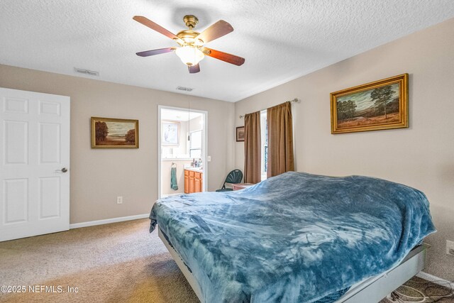 2097 Frogmore Dr, Middleburg, FL 32068 - carpeted bedroom featuring baseboards, a textured ceiling, ceiling fan, and ensuite bathroom