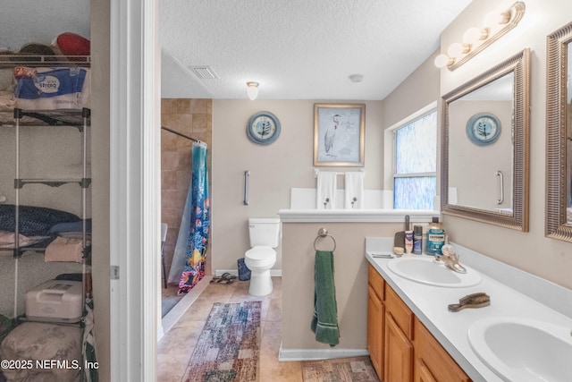 2097 Frogmore Dr, Middleburg, FL 32068 - bathroom featuring toilet, double vanity, a shower with shower curtain, and a textured ceiling