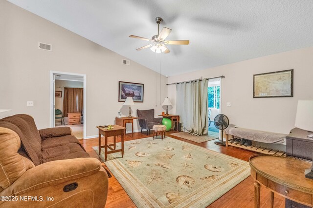 2097 Frogmore Dr, Middleburg, FL 32068 - living room with a ceiling fan, wood finished floors, baseboards, and high vaulted ceiling
