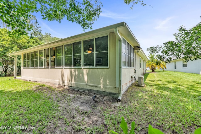 2097 Frogmore Dr, Middleburg, FL 32068 - view of side of home featuring central AC, a lawn, and a sunroom