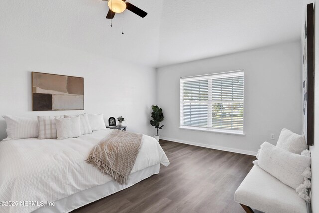 3409 Steelgate Ct, Middleburg, FL 32068 - bedroom featuring wood finished floors, vaulted ceiling, baseboards, and ceiling fan