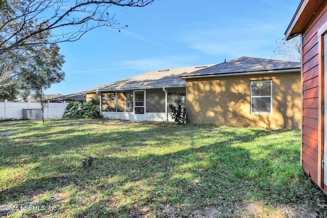 3409 Steelgate Ct, Middleburg, FL 32068 - back of house featuring roof with shingles and a sunroom