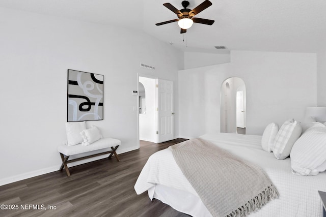 3409 Steelgate Ct, Middleburg, FL 32068 - bedroom with dark wood-style flooring, baseboards, arched walkways, a ceiling fan, and high vaulted ceiling