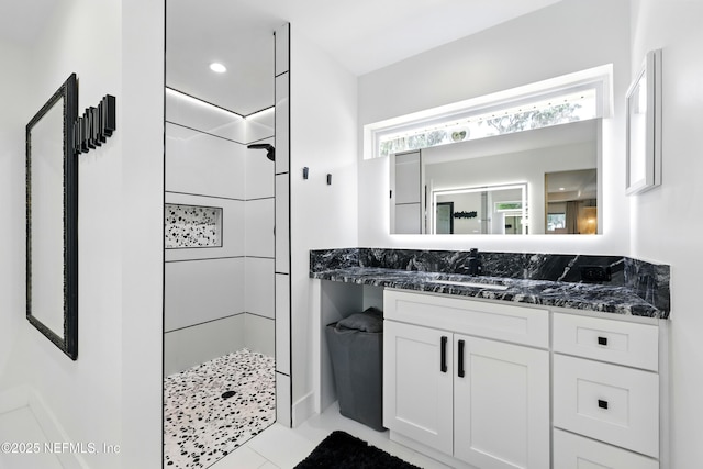 13900 County Road 13 N, Saint Augustine, FL 32092 - bathroom featuring tiled shower, vanity, and tile patterned floors