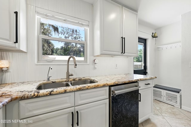 13900 County Road 13 N, Saint Augustine, FL 32092 - kitchen with a sink, dishwasher, light stone countertops, white cabinets, and light tile patterned floors