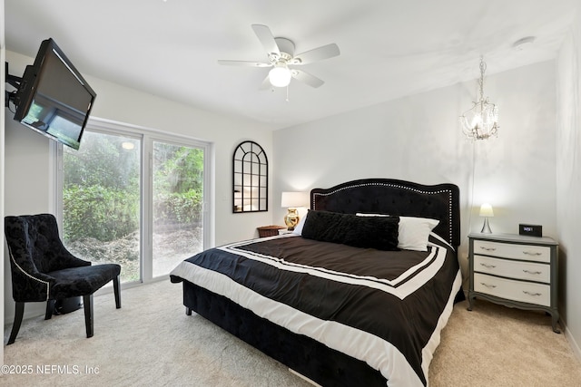 13900 County Road 13 N, Saint Augustine, FL 32092 - carpeted bedroom featuring access to outside, a chandelier, and ceiling fan