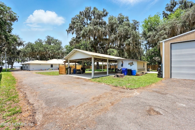 13900 County Road 13 N, Saint Augustine, FL 32092 - view of front facade with a carport and a front lawn