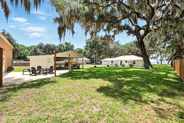 13900 County Road 13 N, Saint Augustine, FL 32092 - view of yard with a patio and an outdoor fire pit