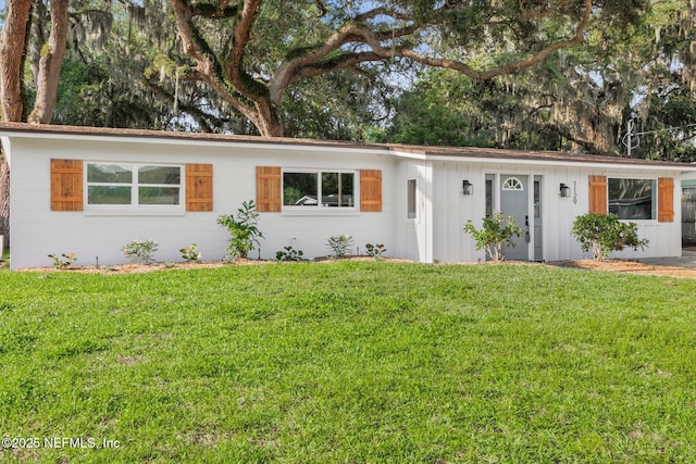 1129 Sebago Ave N, Jacksonville, FL 32233 - ranch-style house with a front yard and board and batten siding