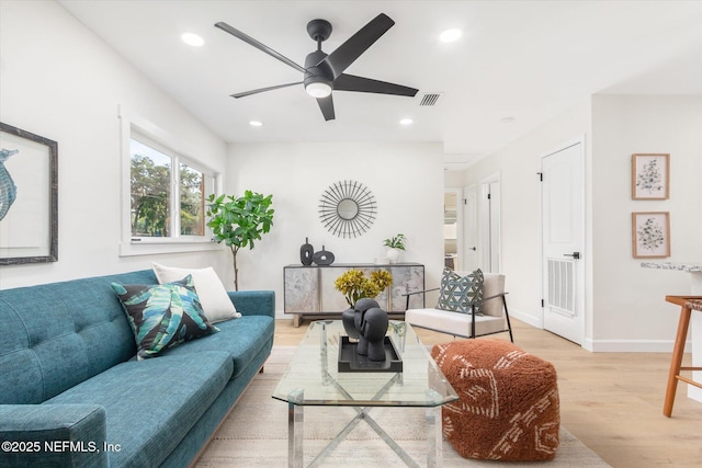 1129 Sebago Ave N, Jacksonville, FL 32233 - living area with wood finished floors, a ceiling fan, recessed lighting, and baseboards