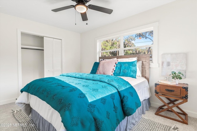 1129 Sebago Ave N, Jacksonville, FL 32233 - carpeted bedroom with baseboards, a closet, and a ceiling fan