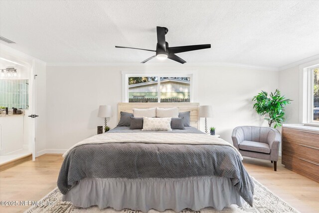1129 Sebago Ave N, Jacksonville, FL 32233 - bedroom with wood finished floors, crown molding, a textured ceiling, a ceiling fan, and baseboards