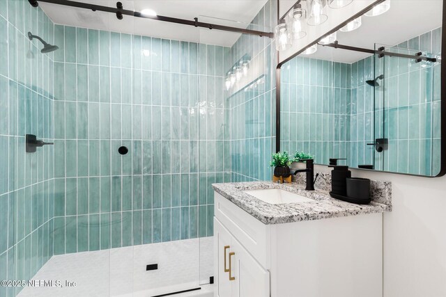 1129 Sebago Ave N, Jacksonville, FL 32233 - full bathroom with vanity, tile walls, and tiled shower