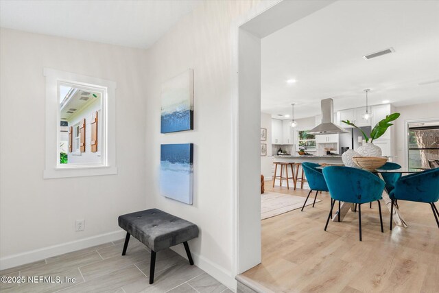 1129 Sebago Ave N, Jacksonville, FL 32233 - hallway featuring baseboards and light wood-style flooring