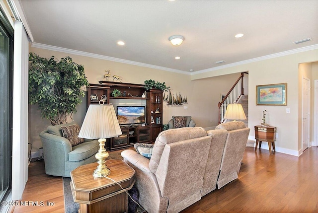 13409 Isla Vista Dr, Jacksonville, FL 32224 - living room featuring wood finished floors, stairway, baseboards, crown molding, and recessed lighting
