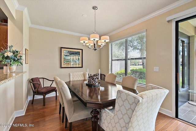 13409 Isla Vista Dr, Jacksonville, FL 32224 - dining area with light wood-type flooring, crown molding, baseboards, and a chandelier