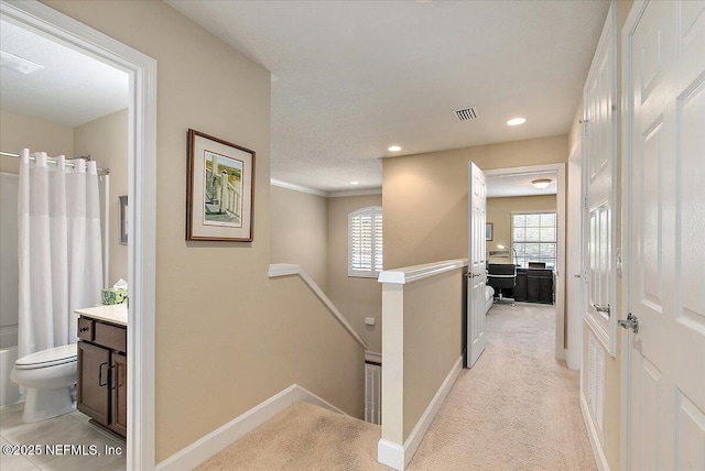 13409 Isla Vista Dr, Jacksonville, FL 32224 - hall featuring an upstairs landing, healthy amount of natural light, light colored carpet, recessed lighting, and baseboards