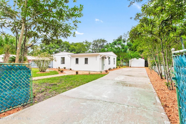 3832 Bunnell Dr, Jacksonville, FL 32246 - view of front facade featuring concrete driveway and stucco siding