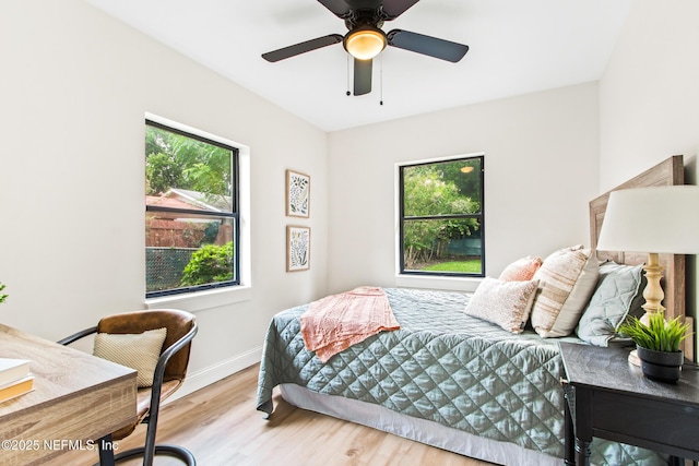 3832 Bunnell Dr, Jacksonville, FL 32246 - bedroom featuring wood finished floors, a desk, baseboards, and ceiling fan